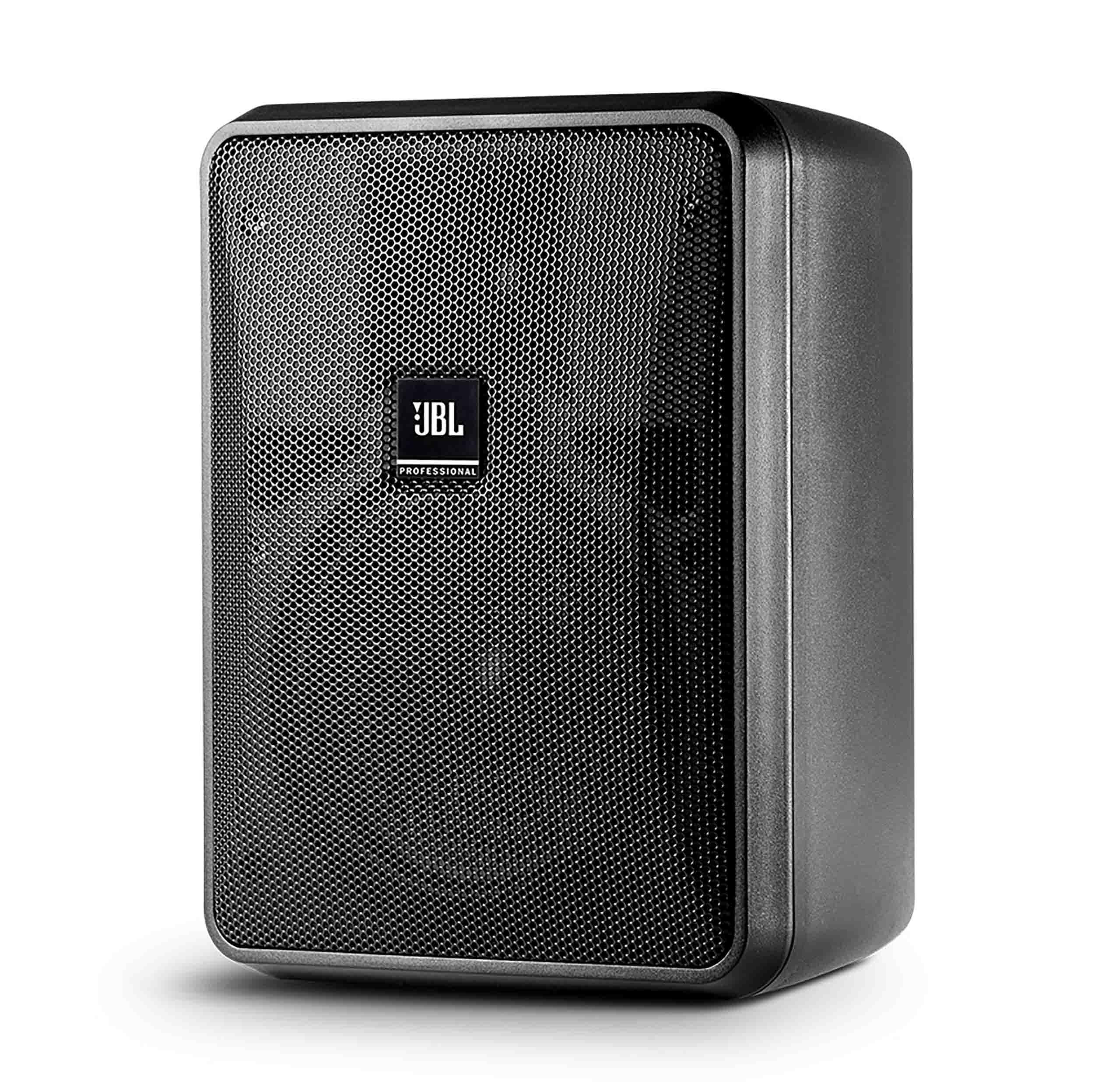 A pair of JBL E10 active speakers positioned on a desk, highlighting their compact size and stylish appearance.
