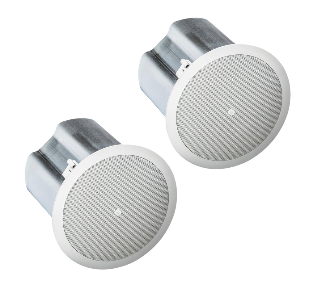 A pair of white speakers set on a white backdrop.